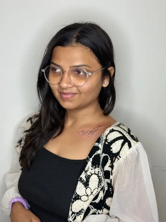 Fine line butterfly and flower tattoo on the collarbone done in Vadodara